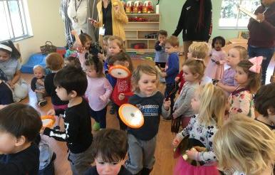 Students at the CLRC playing instruments in music class